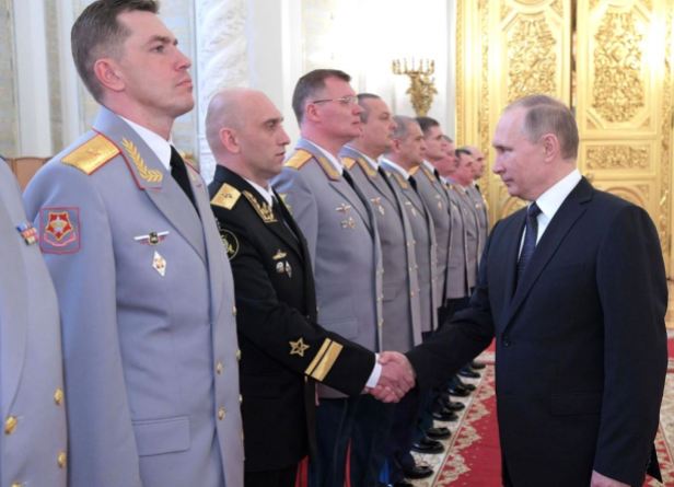 Putin shakes with Rear-Admiral Yakushev (photo Kremlin.ru)
